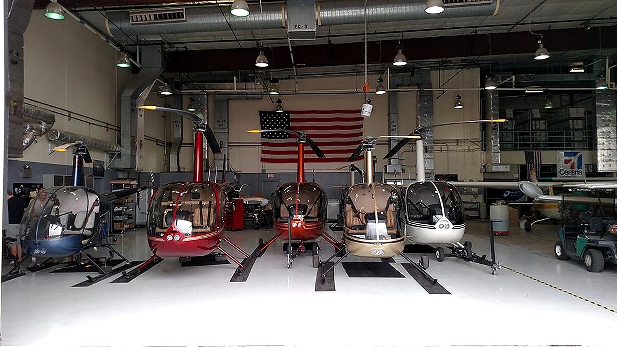 The Robinson fleet lined up in the 702 Aviation hangar